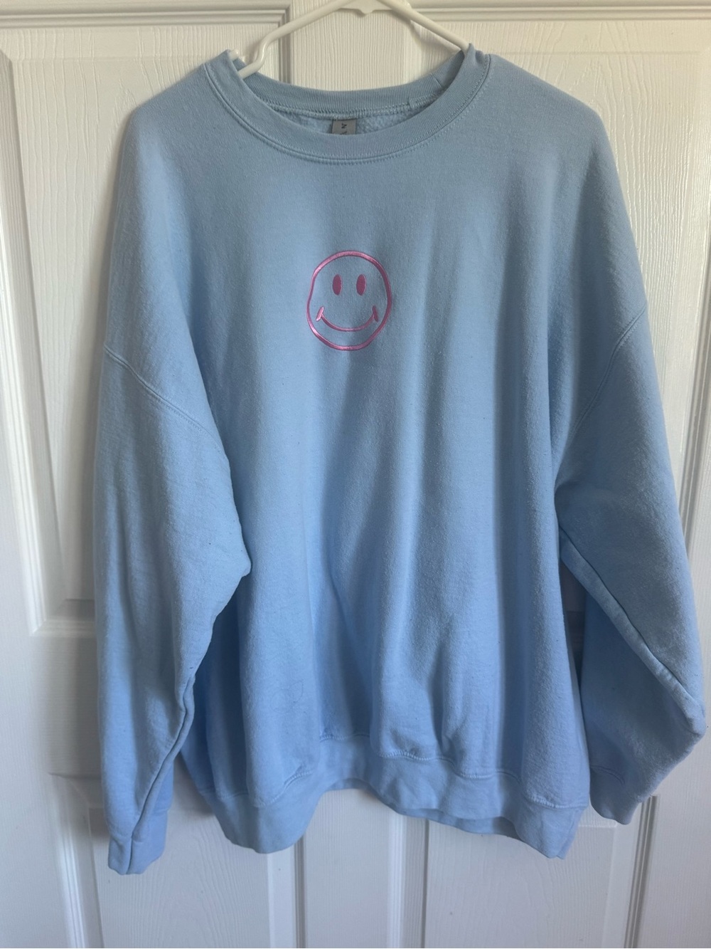 Blue Crewneck with a Pink Smiley Face